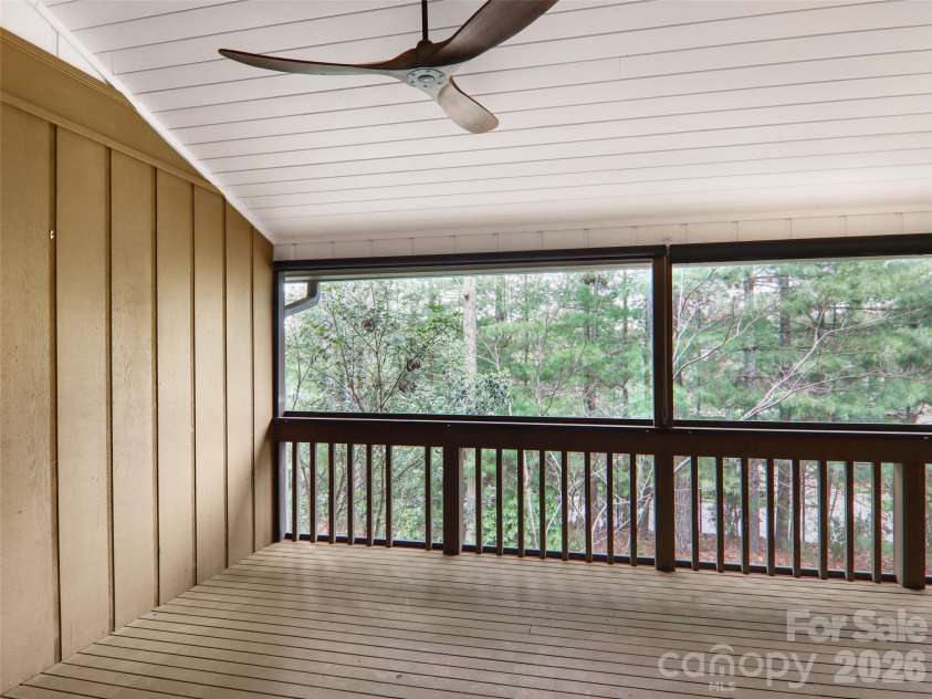 457 Crowfields Drive, Asheville, NC 28803.  MLS# CAR4357281, YatesRealty ID 3870. Serene screened porch 