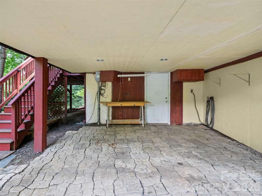 125 Heartland Lane, Burnsville, NC 28714.  MLS# CAR4273356, YatesRealty ID 3871. Basement walk out sitting/work area.