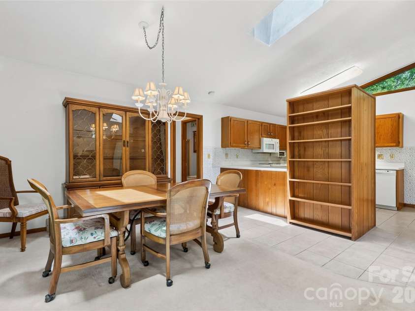 109 Usdasdi Drive, Brevard, NC 28712.  MLS# CAR4405898, YatesRealty ID 38717. Dining area conveniently located off the kitchen
