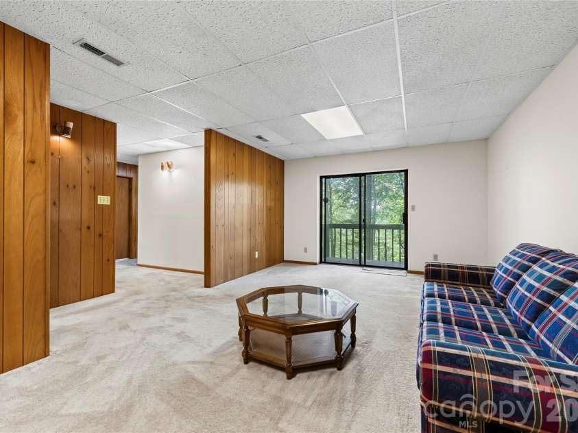 109 Usdasdi Drive, Brevard, NC 28712.  MLS# CAR4405898, YatesRealty ID 38717. Finished lower-level flex space