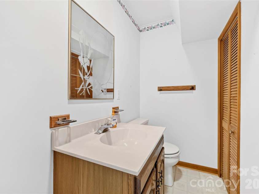 109 Usdasdi Drive, Brevard, NC 28712.  MLS# CAR4405898, YatesRealty ID 38717. Guest bathroom conveniently located on the main level