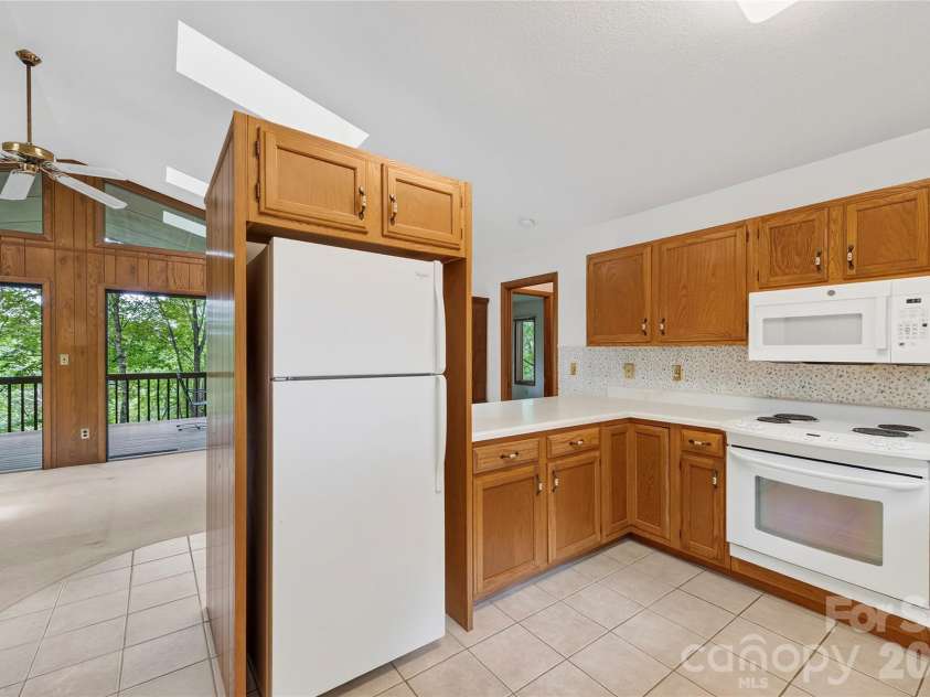 109 Usdasdi Drive, Brevard, NC 28712.  MLS# CAR4405898, YatesRealty ID 38717. Kitchen opens toward the main living areas