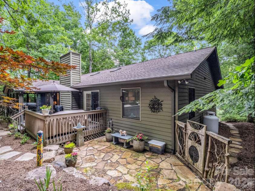 558 Middle Connestee Trail, Brevard, NC 28712.  MLS# CAR4391380, YatesRealty ID 38722. Back of Home w/Rustic Handcrafted Gate