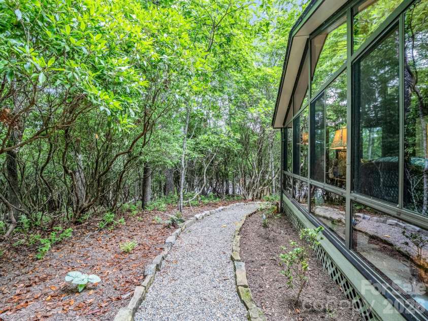 558 Middle Connestee Trail, Brevard, NC 28712.  MLS# CAR4391380, YatesRealty ID 38722. Beautiful Trail Around Home