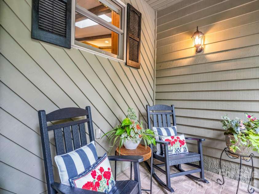 558 Middle Connestee Trail, Brevard, NC 28712.  MLS# CAR4391380, YatesRealty ID 38722. Front Porch Sitting Area