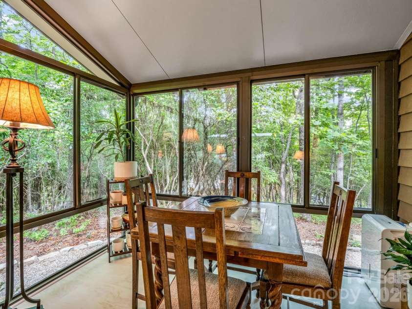 558 Middle Connestee Trail, Brevard, NC 28712.  MLS# CAR4391380, YatesRealty ID 38722. Sunroom Dining/Recreation Area