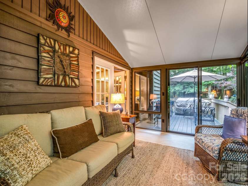 558 Middle Connestee Trail, Brevard, NC 28712.  MLS# CAR4391380, YatesRealty ID 38722. Sunroom w/Entrance to Back Patio