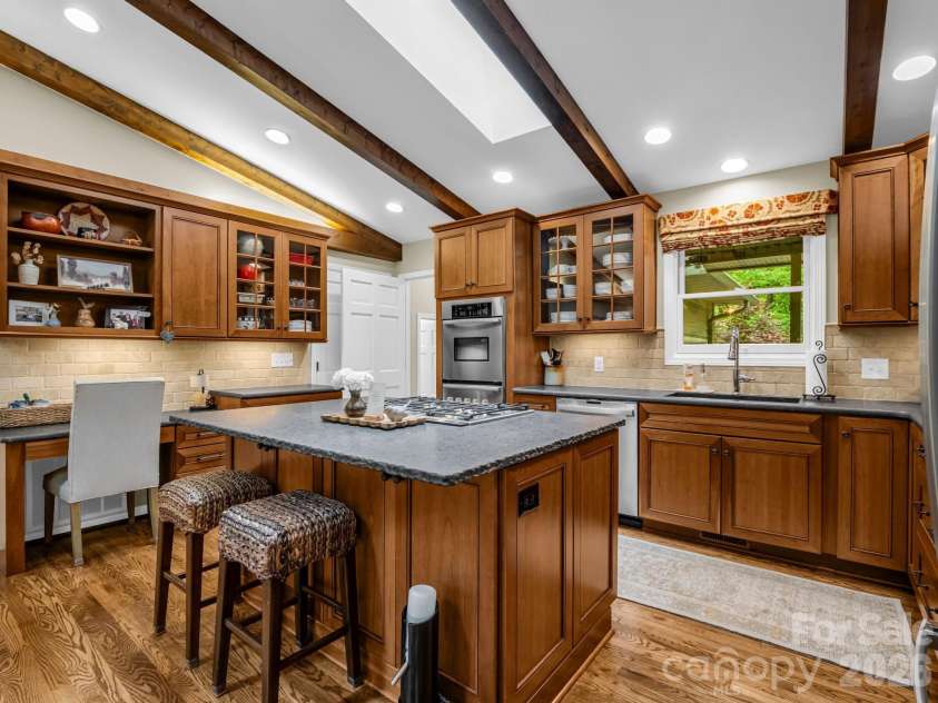558 Middle Connestee Trail, Brevard, NC 28712.  MLS# CAR4391380, YatesRealty ID 38722. Updated Custom Cabinetry and Honed Countertops