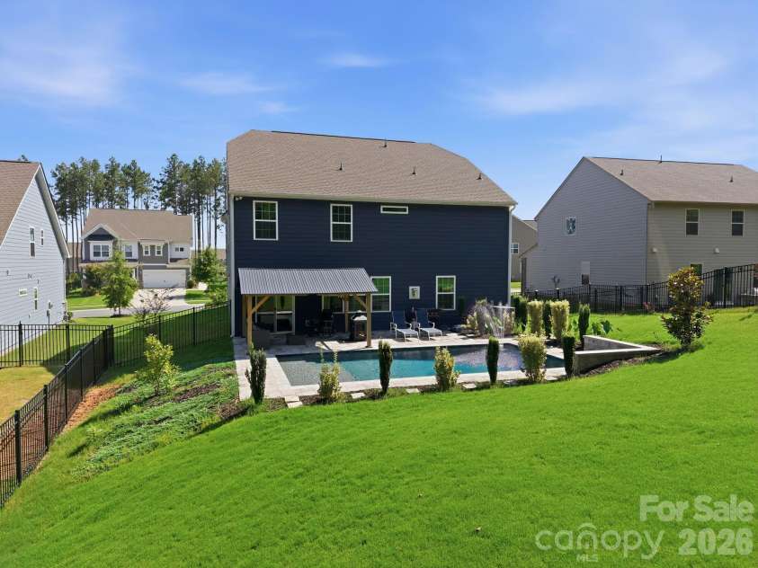 236 Tackle Box Drive, Troutman, NC 28166.  MLS# CAR4403974, YatesRealty ID 38734. Professionally graded backyard with saltwater gunite pool
