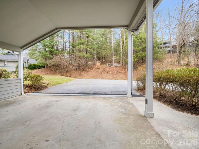 303 Golfside Drive, Flat Rock, NC 28731.  MLS# CAR4352629, YatesRealty ID 3875. Covered Oversized Carport