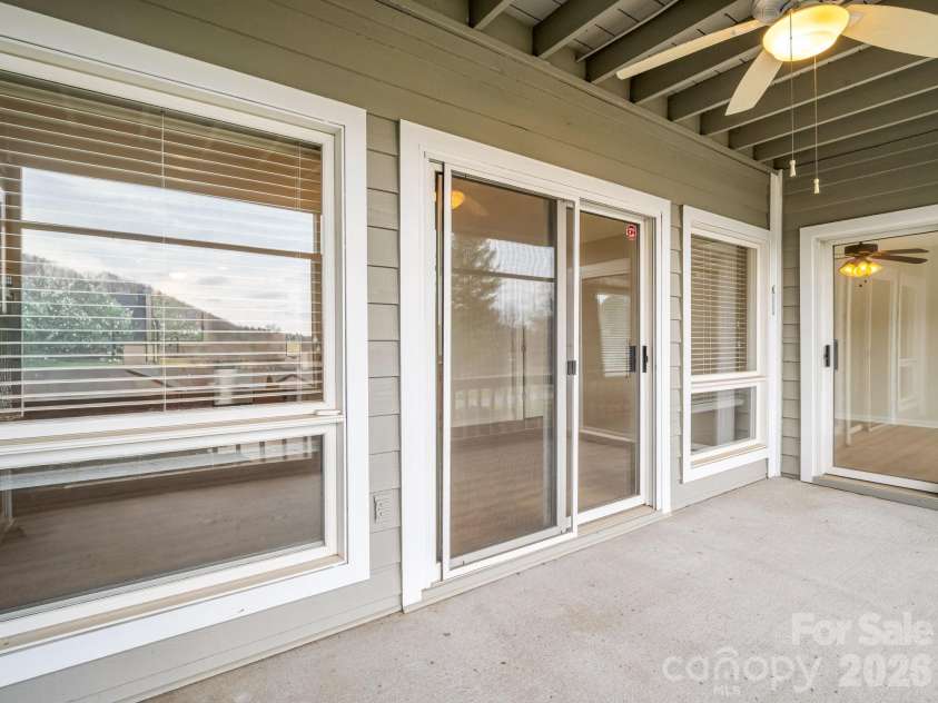 303 Golfside Drive, Flat Rock, NC 28731.  MLS# CAR4352629, YatesRealty ID 3875. Spacious Screened in Patio