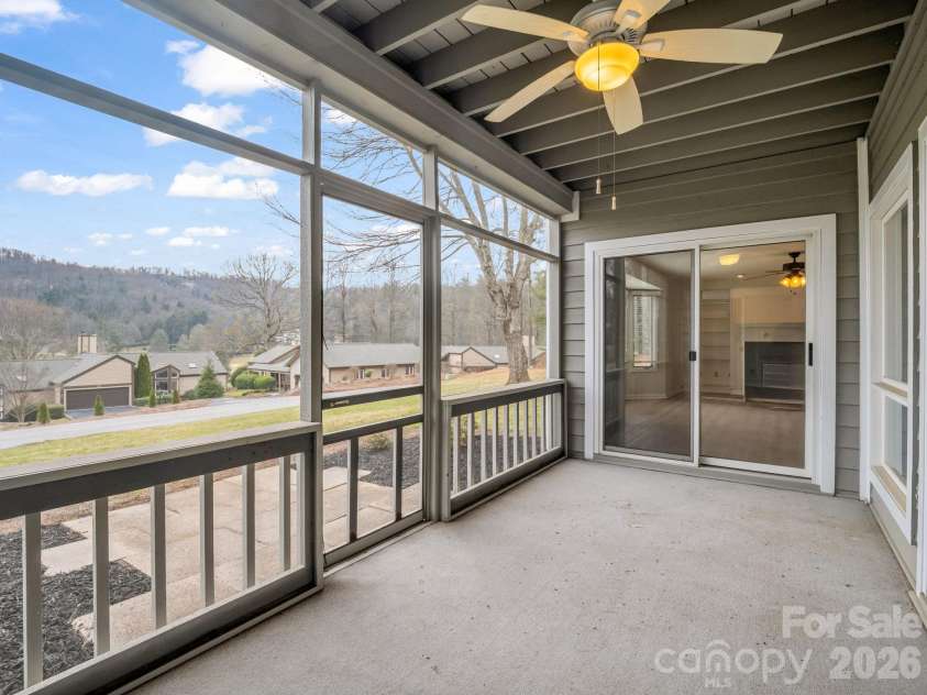 303 Golfside Drive, Flat Rock, NC 28731.  MLS# CAR4352629, YatesRealty ID 3875. Spacious Screened in Patio