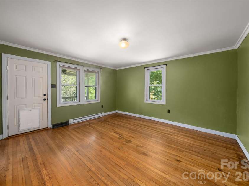 1271 Upper Brush Creek Road, Fairview, NC 28730.  MLS# CAR4398418, YatesRealty ID 38771. Large windows bring in natural light throughout home