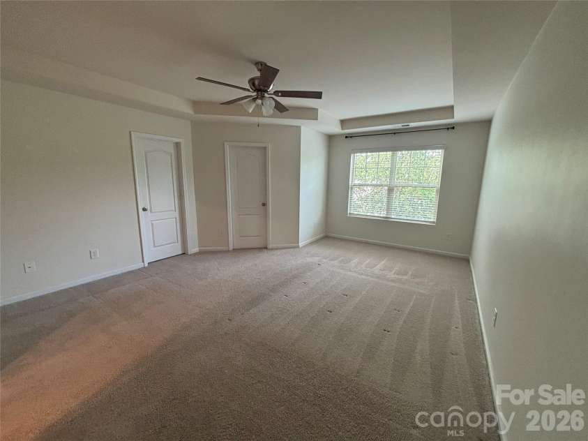 347 Kennebel Place, Fort Mill, SC 29715.  MLS# CAR4402744, YatesRealty ID 38775. Empty Primary Bedroom