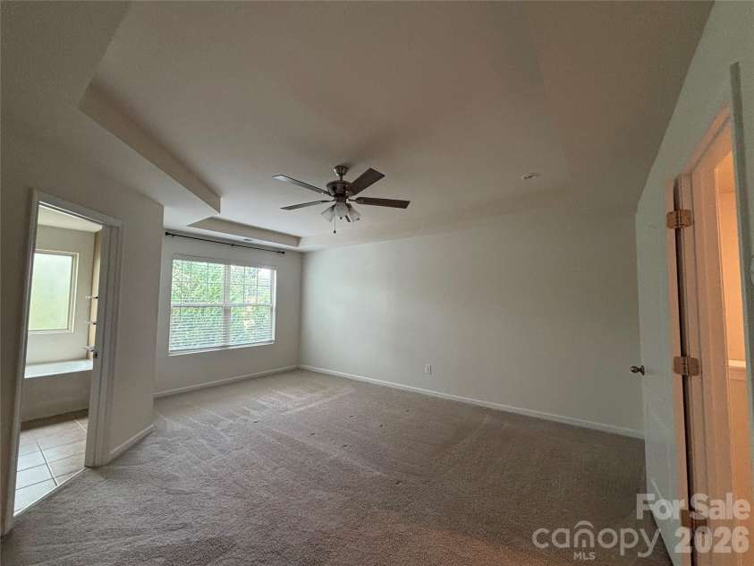 347 Kennebel Place, Fort Mill, SC 29715.  MLS# CAR4402744, YatesRealty ID 38775. Empty Primary Bedroom