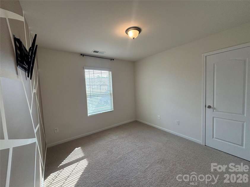 347 Kennebel Place, Fort Mill, SC 29715.  MLS# CAR4402744, YatesRealty ID 38775. Empty Second Bedroom