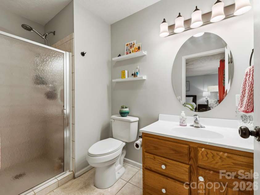210 Hillandale Drive Extension, East Flat Rock, NC 28726.  MLS# CAR4405168, YatesRealty ID 38779. Primary en suite bathroom.
