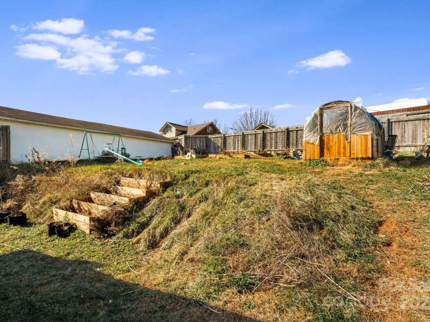 3 Elizabeth Street, Canton, NC 28716.  MLS# CAR4332078, YatesRealty ID 3878. Raised garden beds and a chicken coop are ready and waiting! Chickens can convey!