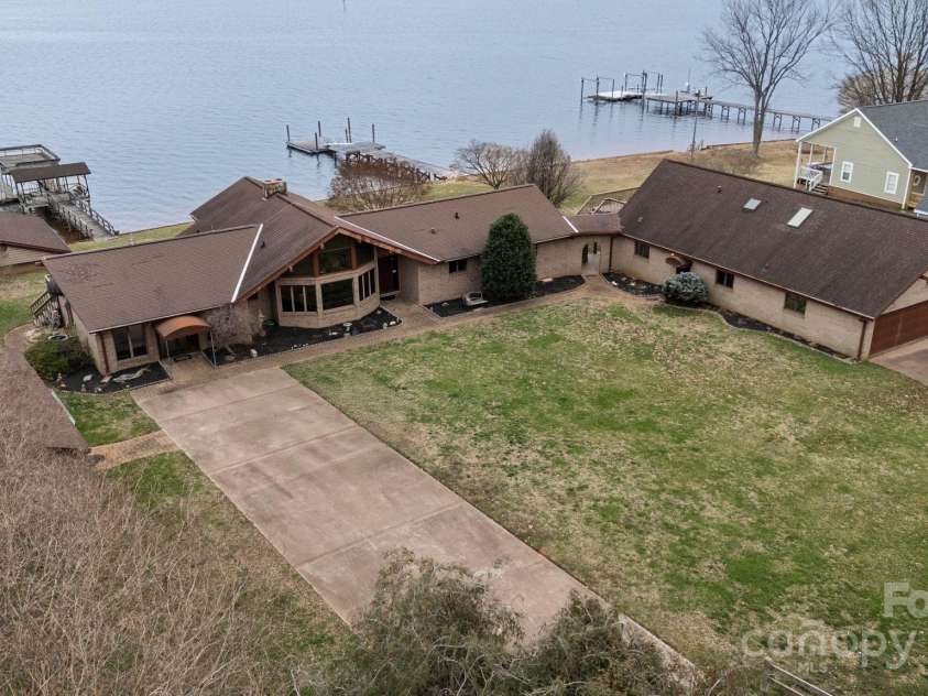 167 Points End Drive, Mooresville, NC 28117.  MLS# CAR4230820, YatesRealty ID 3879. Two driveways for the main house and the 6 car garage with the separate apartment living area