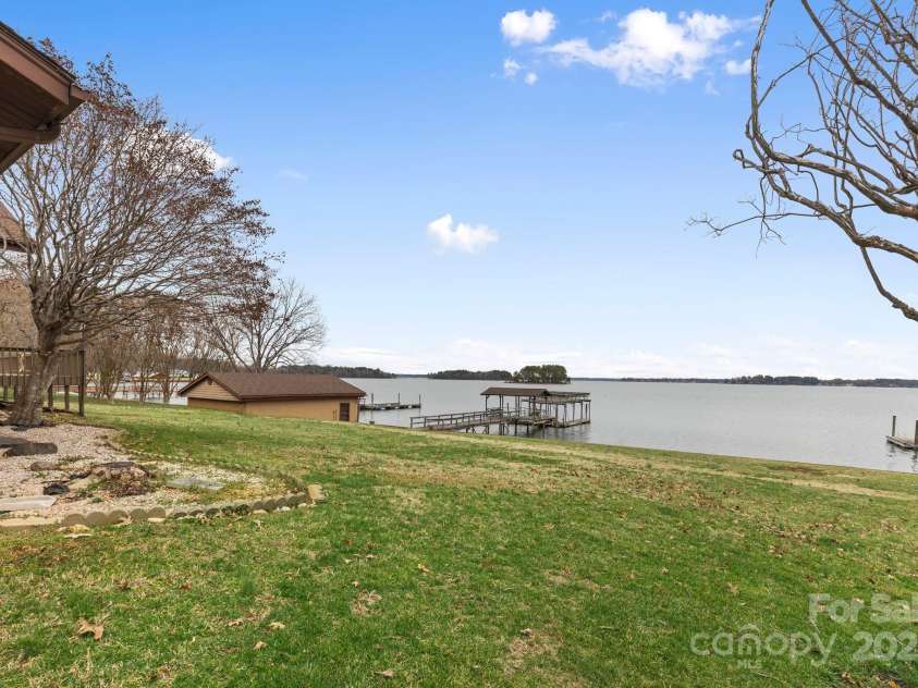 167 Points End Drive, Mooresville, NC 28117.  MLS# CAR4230820, YatesRealty ID 3879. View from yard of double boathouse and stationary dock with double floating dock