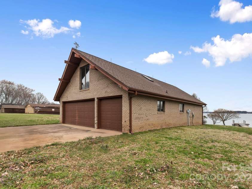 167 Points End Drive, Mooresville, NC 28117.  MLS# CAR4230820, YatesRealty ID 3879. View of 6 car garage with apartment above