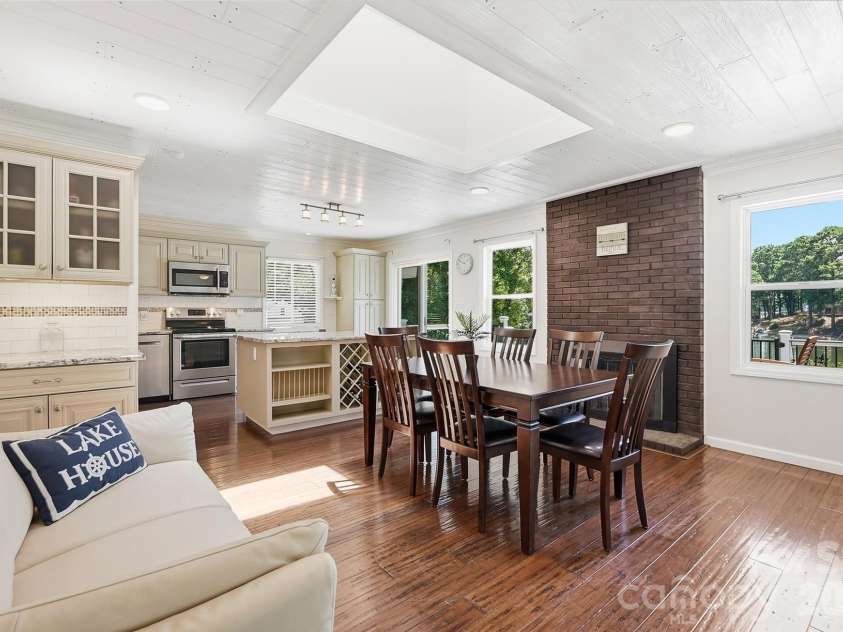 1031 Woodlake Lane, Tega Cay, SC 29708.  MLS# CAR4403706, YatesRealty ID 38797. Dining area with fireplace