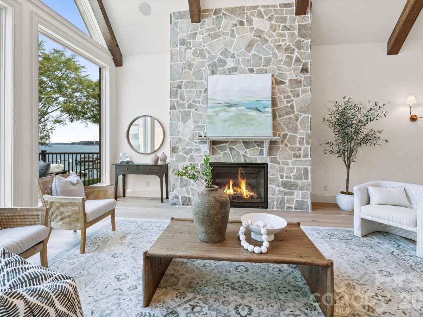 2494 Primm Road, Denver, NC 28037.  MLS# CAR4395617, YatesRealty ID 38800. Stone fireplace and beamed vaulted ceilings