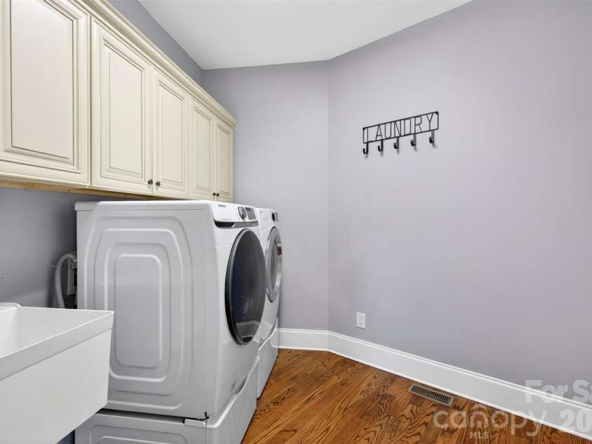 2330 Shiny Leaf Drive, Denver, NC 28037.  MLS# CAR4384279, YatesRealty ID 38812. Laundry Room with cabinetry and sink.