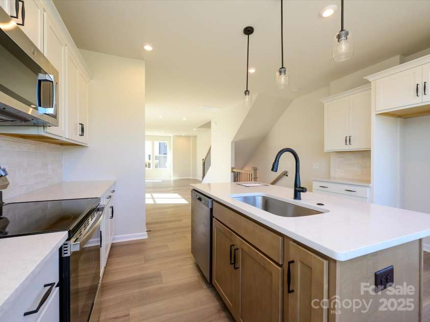 5711 Castlerea Drive, Charlotte, NC 28217.  MLS# CAR4232177, YatesRealty ID 3882. GE Stainless appliances and a single basin sink round out this space.