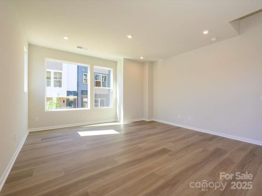 5711 Castlerea Drive, Charlotte, NC 28217.  MLS# CAR4232177, YatesRealty ID 3882. Great room with 9' ceilings to make the space feel grand and open.