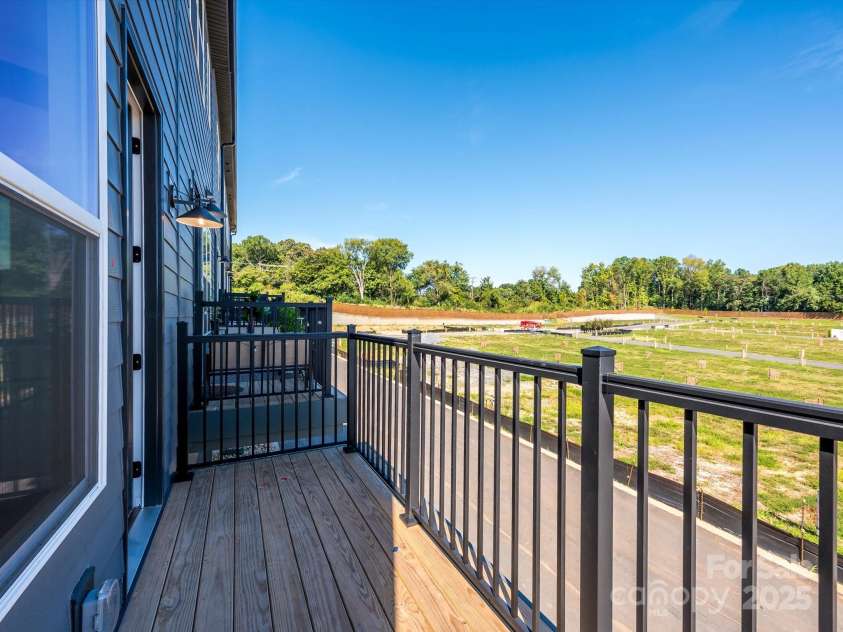 5711 Castlerea Drive, Charlotte, NC 28217.  MLS# CAR4232177, YatesRealty ID 3882. Outdoor living on the second floor that you'll actually spend time in.