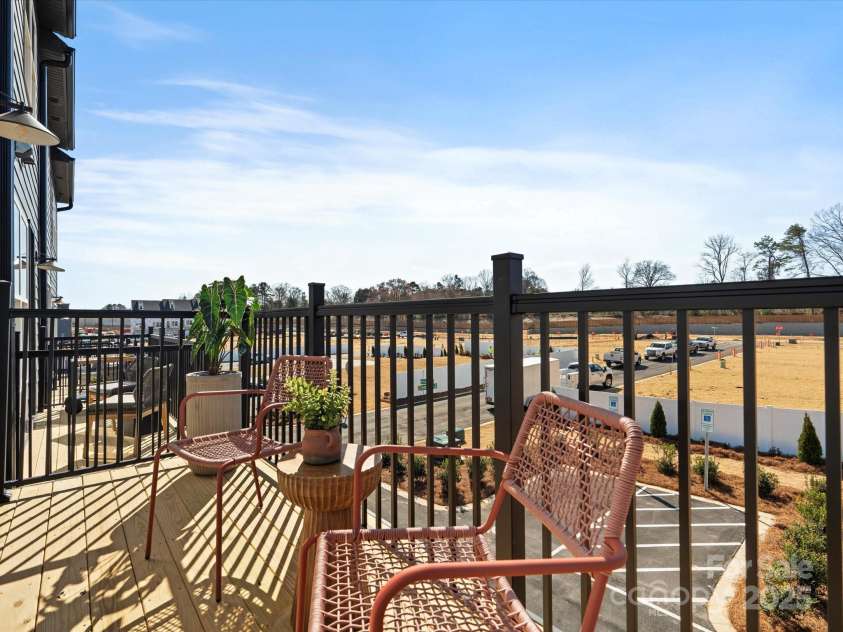 5711 Castlerea Drive, Charlotte, NC 28217.  MLS# CAR4232177, YatesRealty ID 3882. Roan Model Home Balcony | Southmont *actual finishes, color scheme, orientation vary on this home. Furniture not included