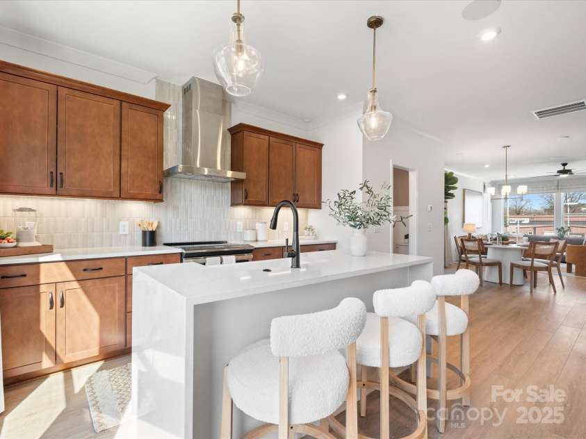 5711 Castlerea Drive, Charlotte, NC 28217.  MLS# CAR4232177, YatesRealty ID 3882. Roan Model Home Kitchen | Southmont *actual finishes, color scheme, orientation vary on this home. Furniture not included