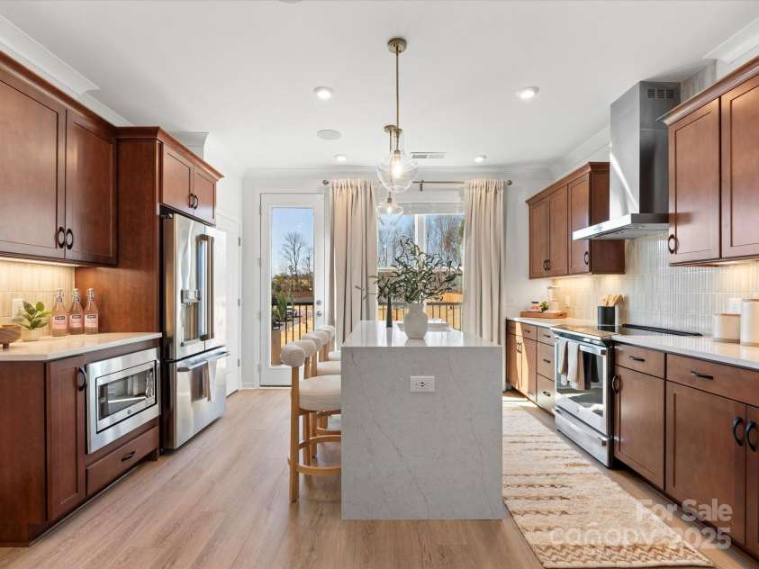 5711 Castlerea Drive, Charlotte, NC 28217.  MLS# CAR4232177, YatesRealty ID 3882. Roan Model Home Kitchen | Southmont *actual finishes, color scheme, orientation vary on this home. Furniture not included