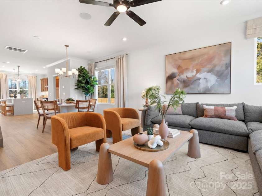 5711 Castlerea Drive, Charlotte, NC 28217.  MLS# CAR4232177, YatesRealty ID 3882. Roan Model Home Living Area | Southmont *actual finishes, color scheme, orientation vary on this home. Furniture not included