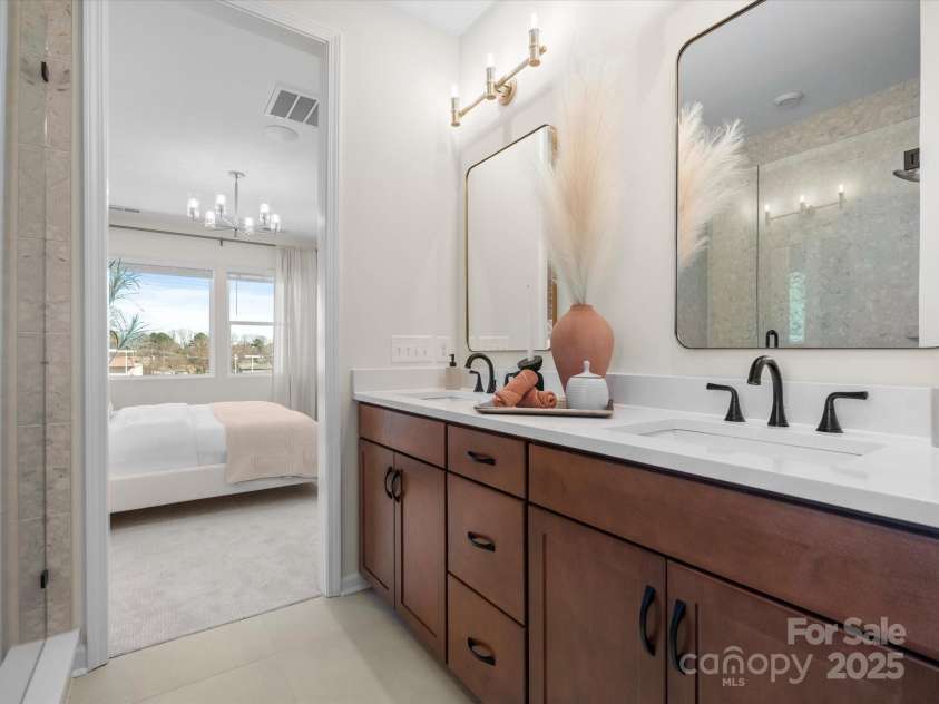 5711 Castlerea Drive, Charlotte, NC 28217.  MLS# CAR4232177, YatesRealty ID 3882. Roan Model Home Primary Bath | Southmont *actual finishes, color scheme, orientation vary on this home. Furniture not included