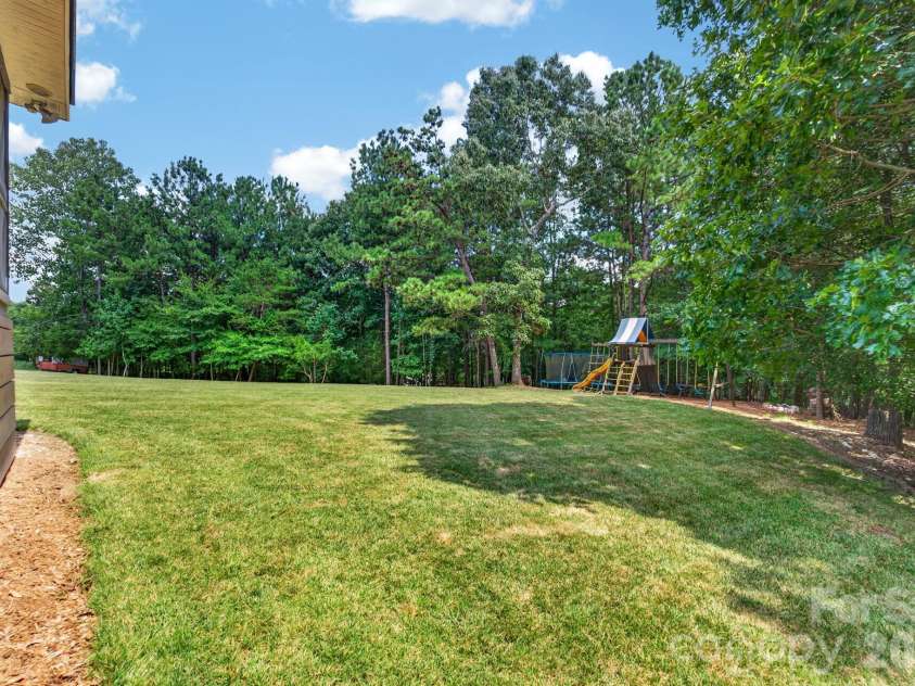 106 Spinnaker Bay Lane, Lake Wylie, SC 29710.  MLS# CAR4404488, YatesRealty ID 38827. Backyard view