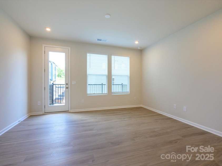 5640 Kingspan Drive, Charlotte, NC 28217.  MLS# CAR4232672, YatesRealty ID 3883. Great Room Leading to Outdoor Living Through 8' Doorway.