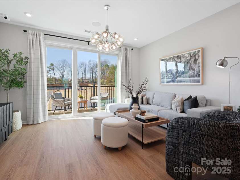 5640 Kingspan Drive, Charlotte, NC 28217.  MLS# CAR4232672, YatesRealty ID 3883. Merrill Model Living Area | Southmont *actual finishes, color scheme, orientation vary on this home. Furniture not included
