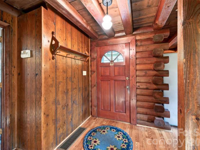 82 Sharon Road, Fairview, NC 28730.  MLS# CAR4404789, YatesRealty ID 38830. Authentic Log Cabin that's Well Maintained