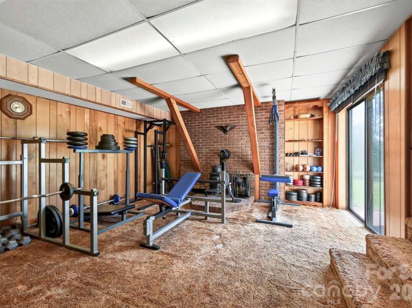 82 Sharon Road, Fairview, NC 28730.  MLS# CAR4404789, YatesRealty ID 38830. Daylight Basement Bonus Room