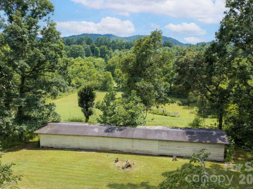 82 Sharon Road, Fairview, NC 28730.  MLS# CAR4404789, YatesRealty ID 38830. Run in Shed