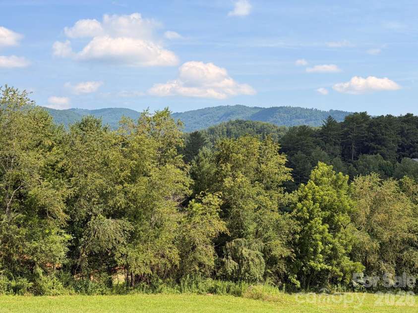 82 Sharon Road, Fairview, NC 28730.  MLS# CAR4404789, YatesRealty ID 38830. Views from the Cabin Porch