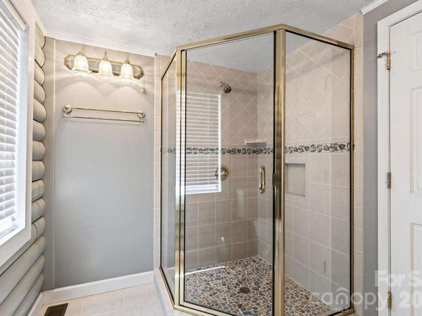 82 Sharon Road, Fairview, NC 28730.  MLS# CAR4404789, YatesRealty ID 38830. With Walk-in Shower