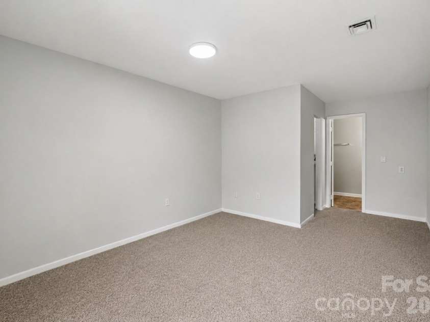 4902 Spring Lake Drive, Charlotte, NC 28212.  MLS# CAR4411853, YatesRealty ID 38851. Primary Bedroom