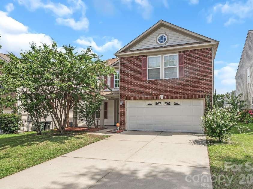 825 Chastain Avenue, Concord, NC 28025.  MLS# CAR4400015, YatesRealty ID 38853. Brick front home with long driveway