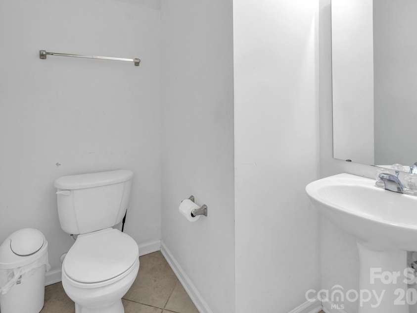 825 Chastain Avenue, Concord, NC 28025.  MLS# CAR4400015, YatesRealty ID 38853. Downstairs half-bathroom