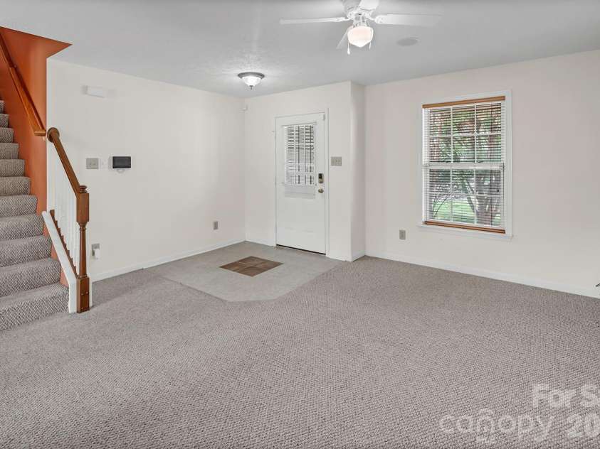 825 Chastain Avenue, Concord, NC 28025.  MLS# CAR4400015, YatesRealty ID 38853. Entry into living room