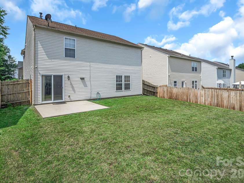 825 Chastain Avenue, Concord, NC 28025.  MLS# CAR4400015, YatesRealty ID 38853. Large open backyard