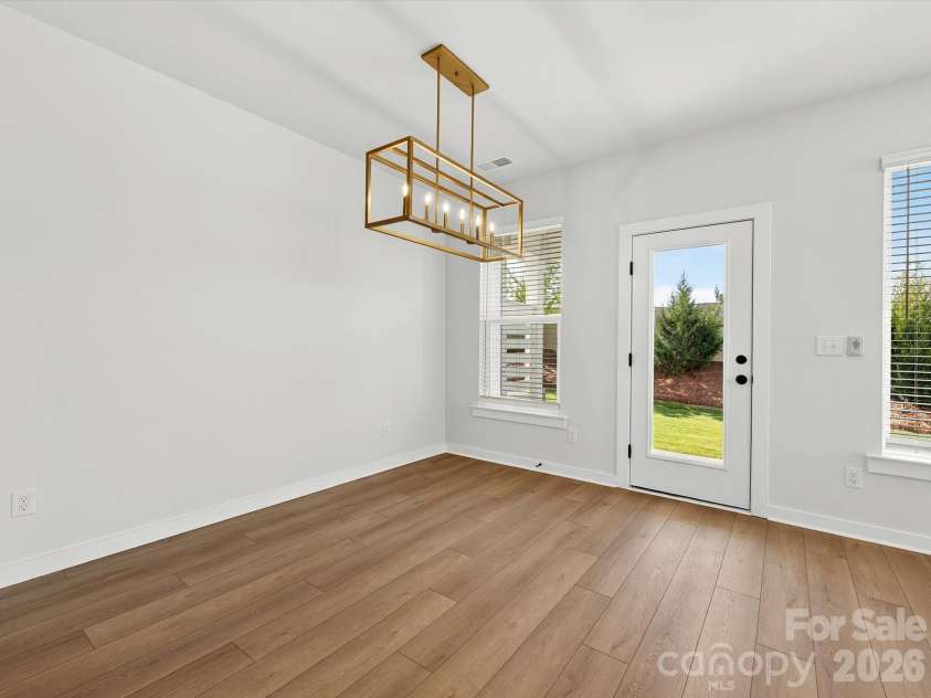 202 Quartz Hill Way, Waxhaw, NC 28173.  MLS# CAR4327858, YatesRealty ID 38881. Dining area with chandelier